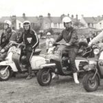 Christine Jackson in Mini TT in England with Lambretta scooters