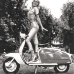 Jayne Mansfield standing on Lambretta scooter