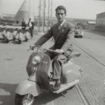 Motorcycle road racer Umberto Masetti with Lambretta scooter